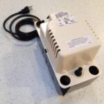 A condensate pump for a central air conditioner, with power cable.
