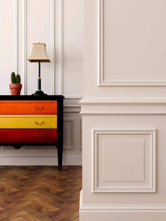 Wainscoting and decorative moldings add traditional style and elegance to these walls.