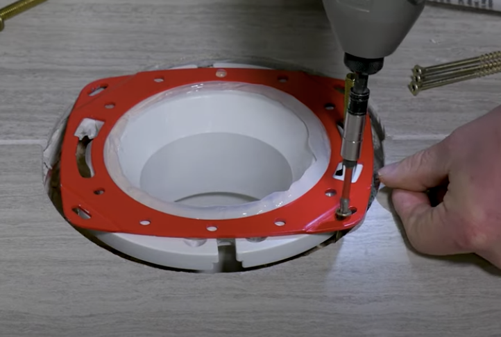screwing repair ring to floor