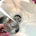 pouring ice into garbage disposal
