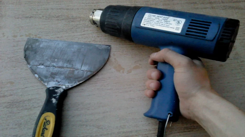 Removing paint from wood using a heat gun