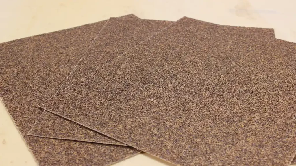 Sanding paint from a wood surface