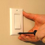 screwdriver removing switch cover