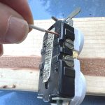 Wire is pushed into hole in receptacle for a backstabbed connection